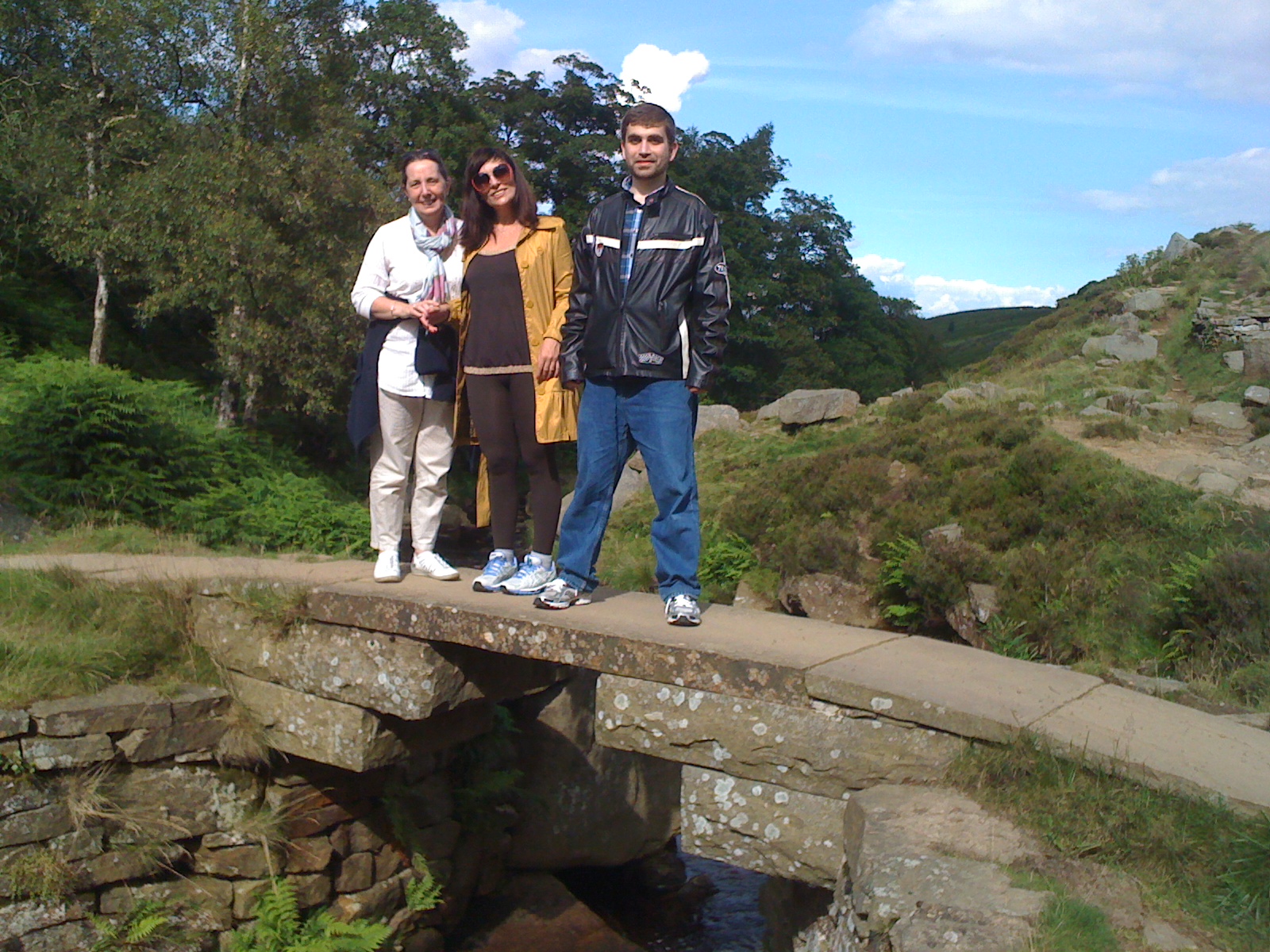 3 people on a bridge