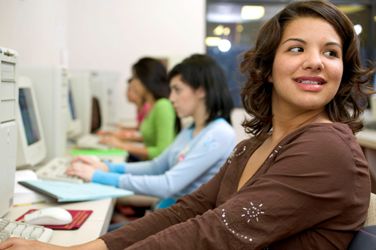 students sitting at computer terminals